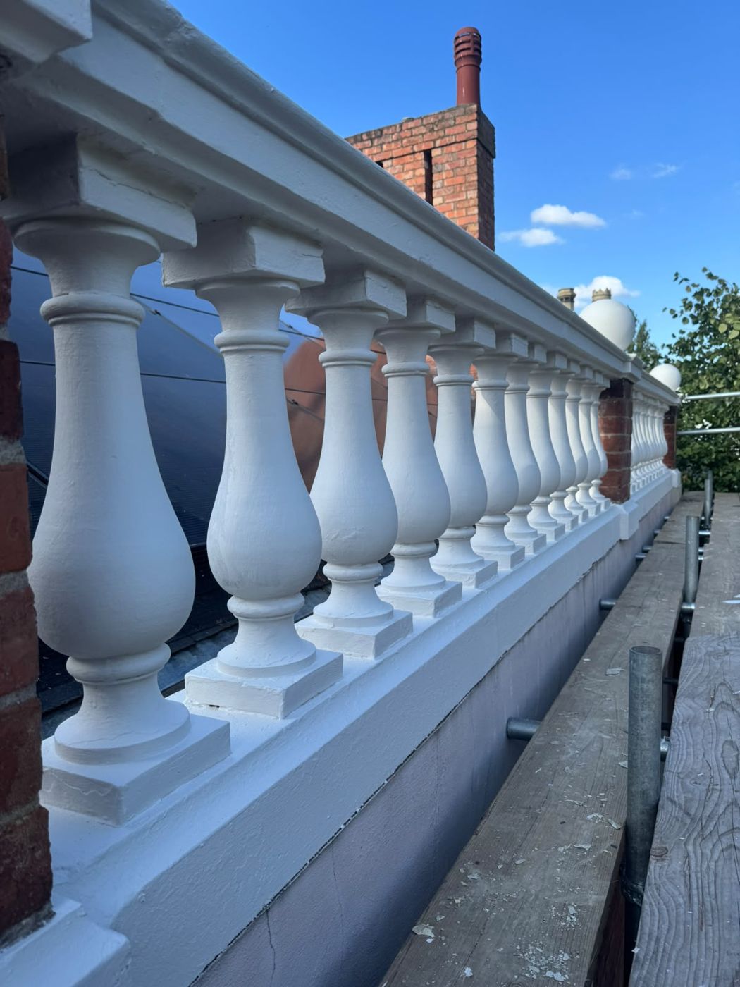 Close-up of the repainted balusters and coping